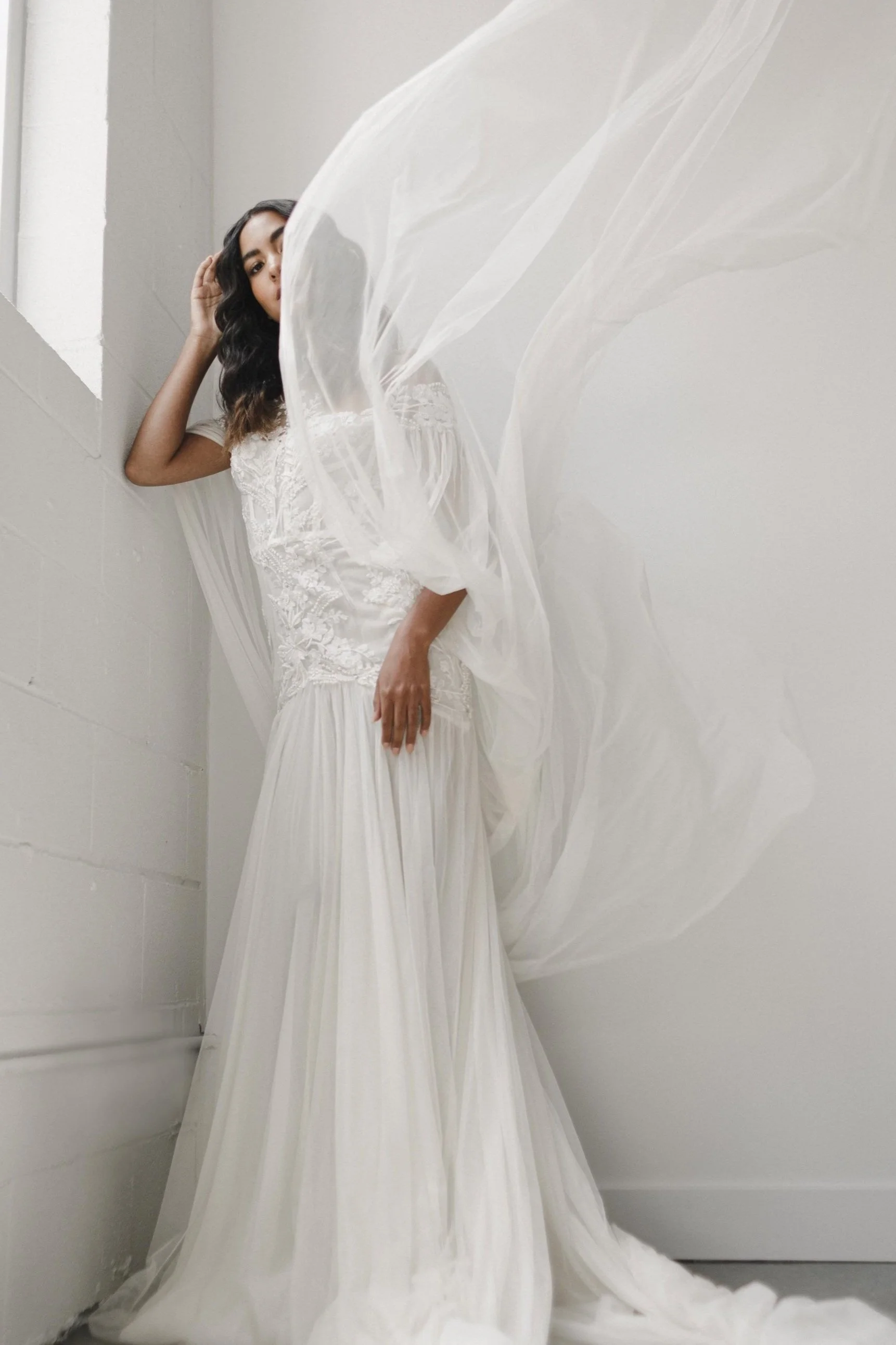 A Hannah Aubrey bride in a flowing lace gown, photographed by Ayaka Sano